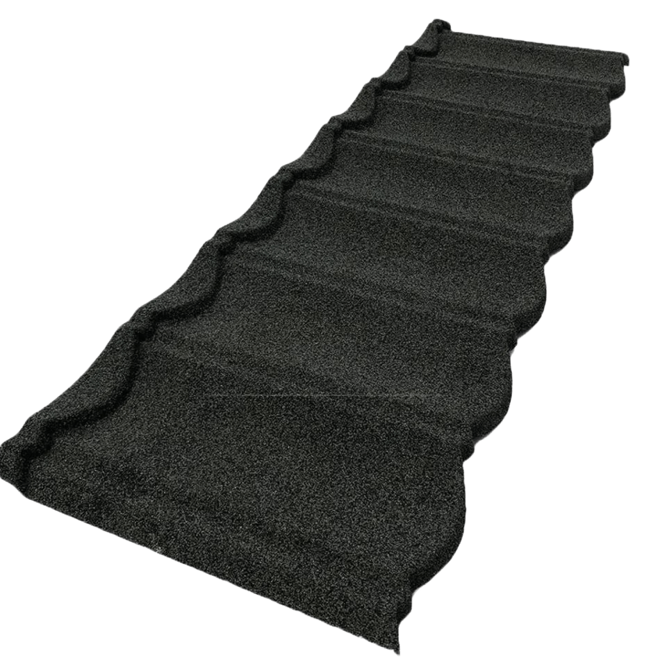 A dark charcoal roofing panel is isolated in the frame. One end appears near the lower left, while the opposite end reaches toward the upper right. Its granular surface has a series of raised transverse bands and a scalloped edge.