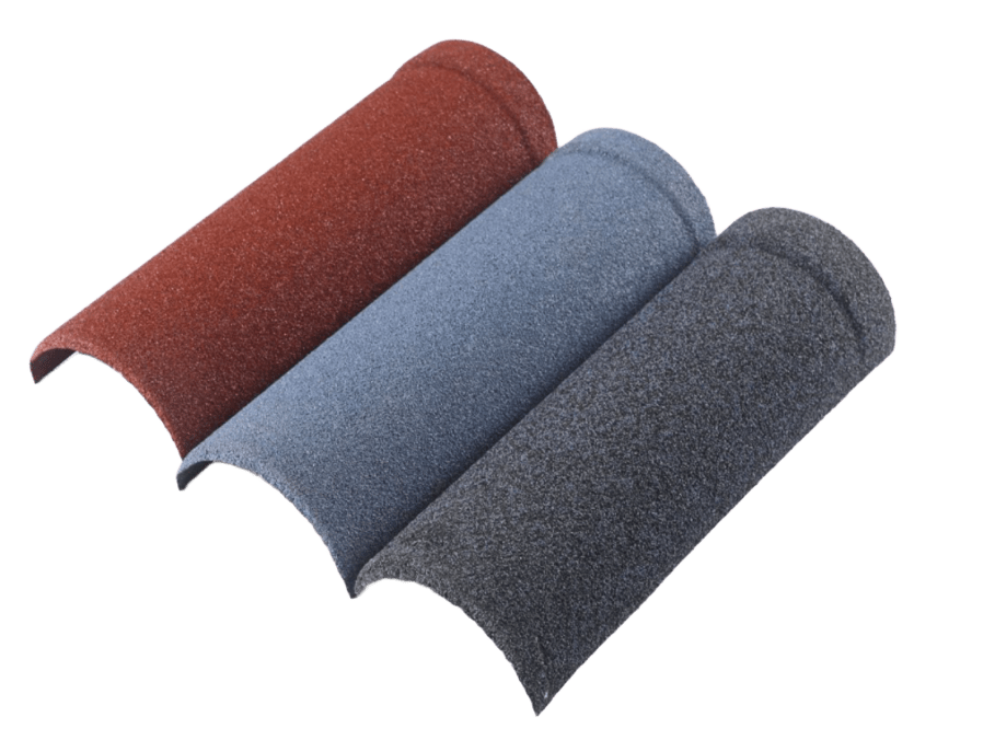 Three arched roofing cap pieces are arranged diagonally, partly overlapping. Their granular surfaces are red-brown, blue-gray, and dark gray from left to right. Each piece has a curved cross-section and a rounded raised end.